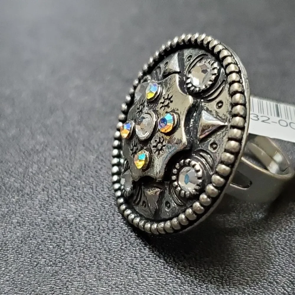 Silver tone circular sparkly ring